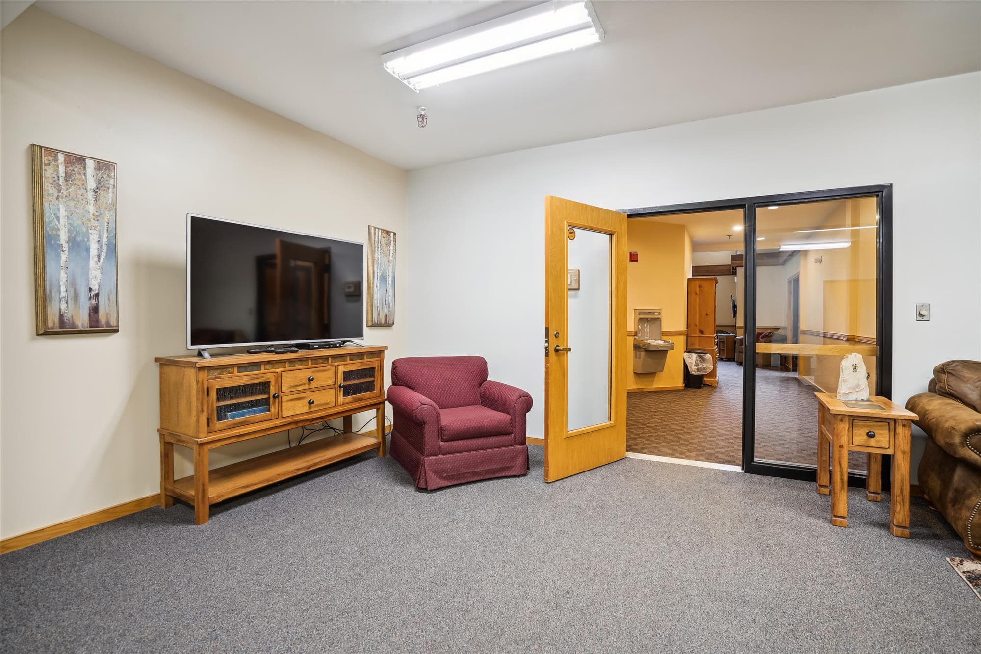 Comfortable lounge area inside the Highridge Sports Center where guests can relax and unwind.