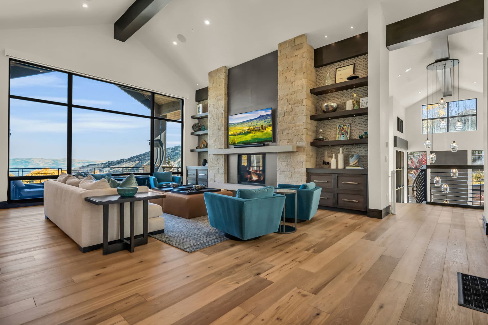 Sofa, Accent Chairs, TV, and Sliding Doors to the Walk Out Balcony
